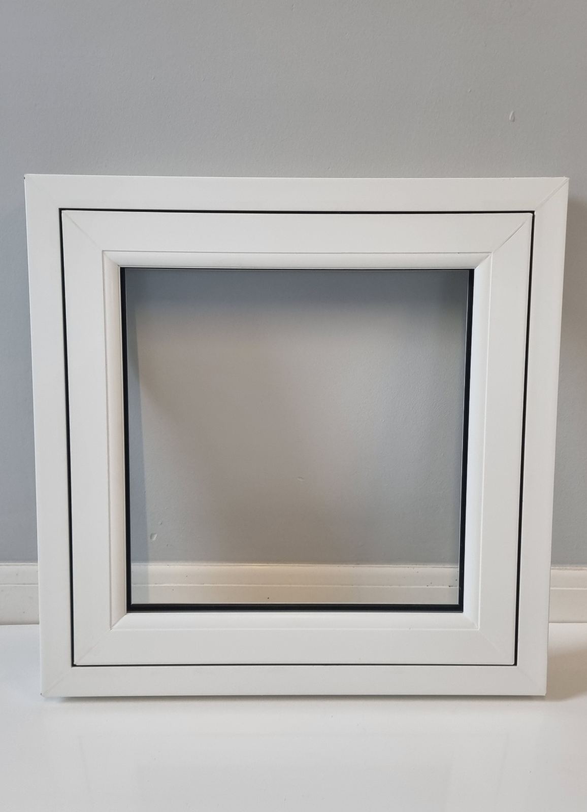 White uPVC fixed casement window — showroom sample