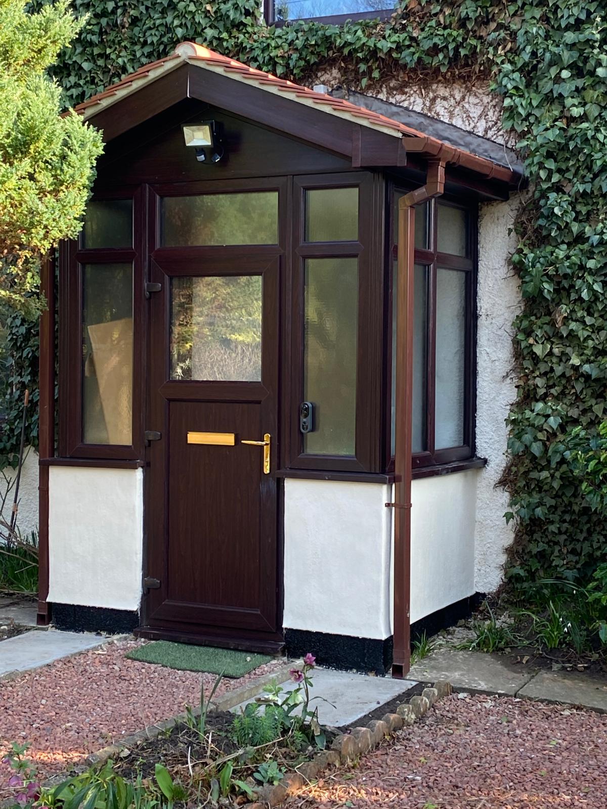 Rosewood uPVC porch with door and side windows