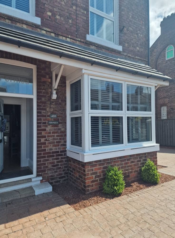 Angled view of a white Liniar flush sash bay window
