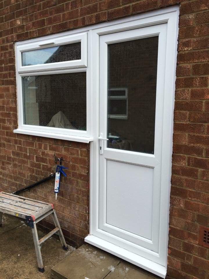 White uPVC back door with matching window fitted by a trusted installer