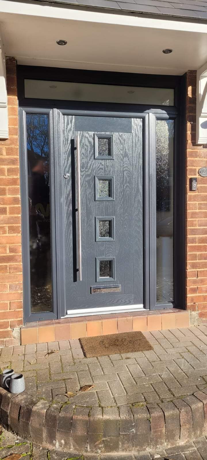 Grey contemporary composite door with square glass panels
