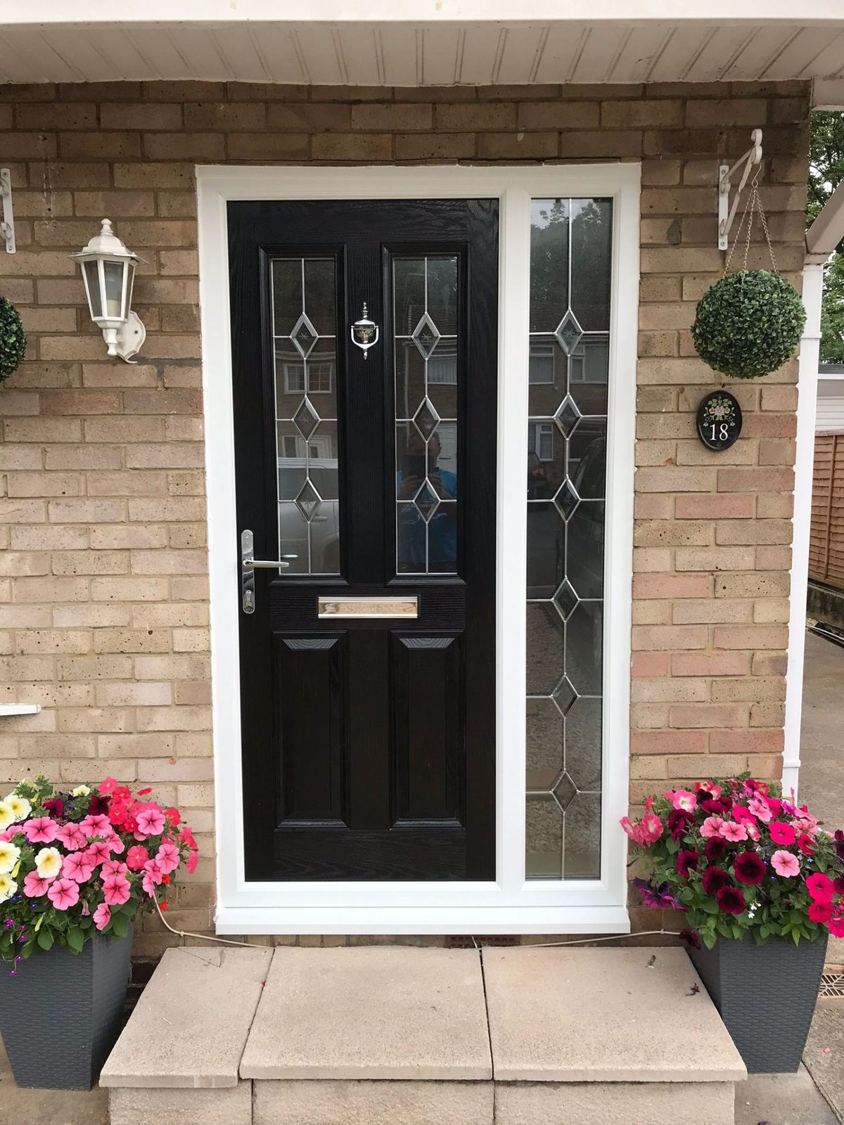 Black composite front door with side panel — fitted by a trusted installer