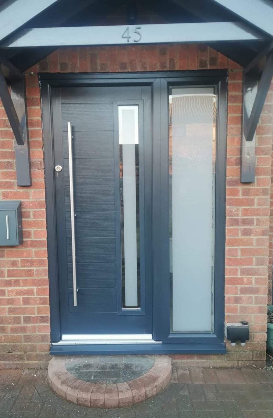 Anthracite grey contemporary front door with vertical sidelight