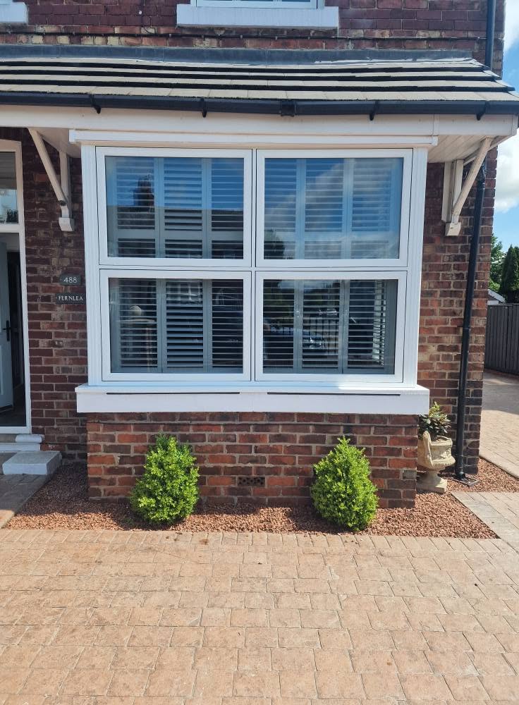 Close-up of a white Liniar flush sash bay window on a period Middlesbrough home