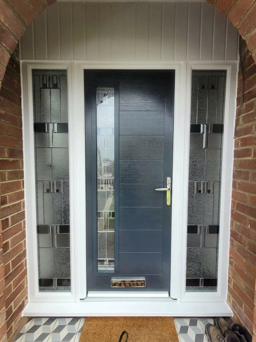 Anthracite grey composite door with tall decorative leaded glass sidelights