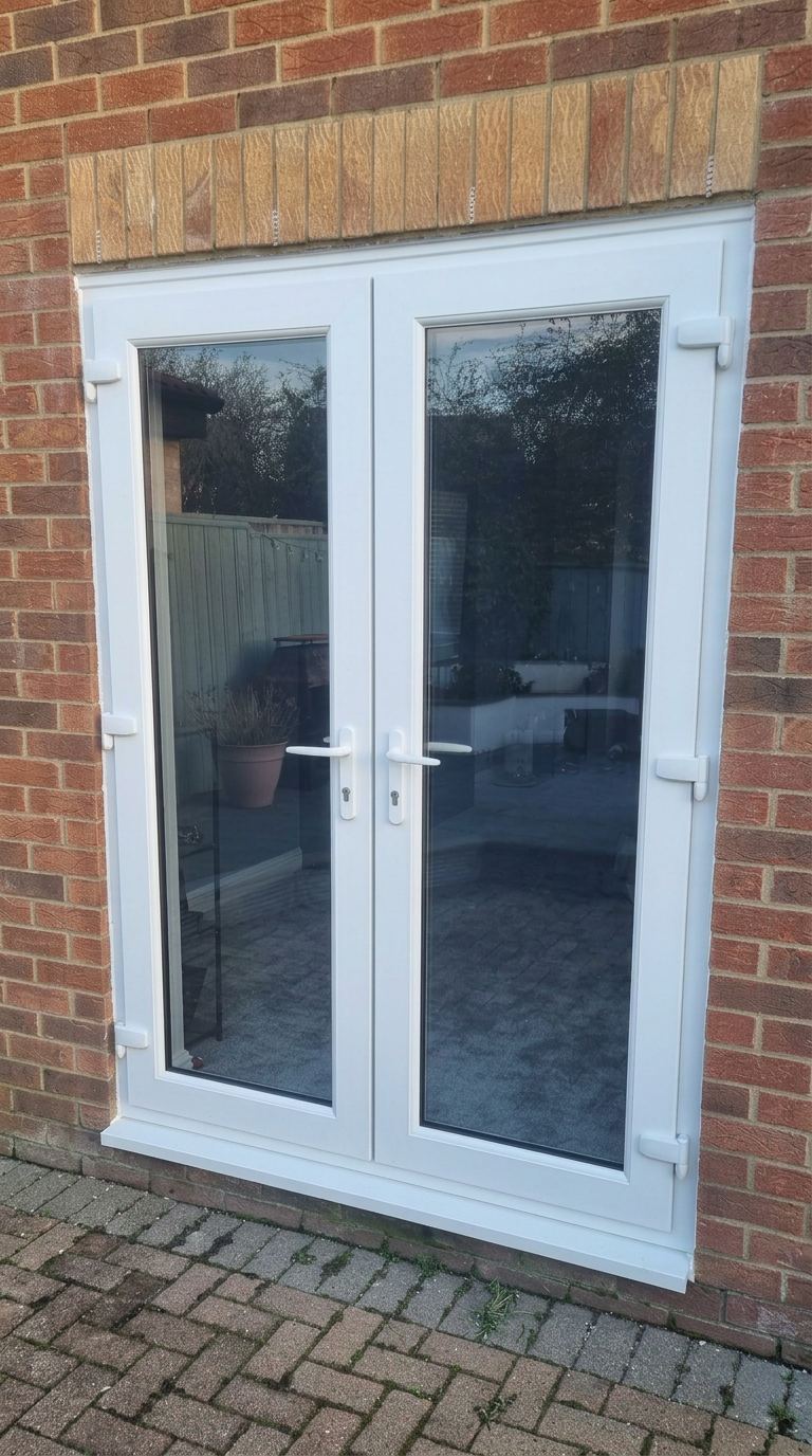 White French doors opening onto patio — fitted by a trusted installer