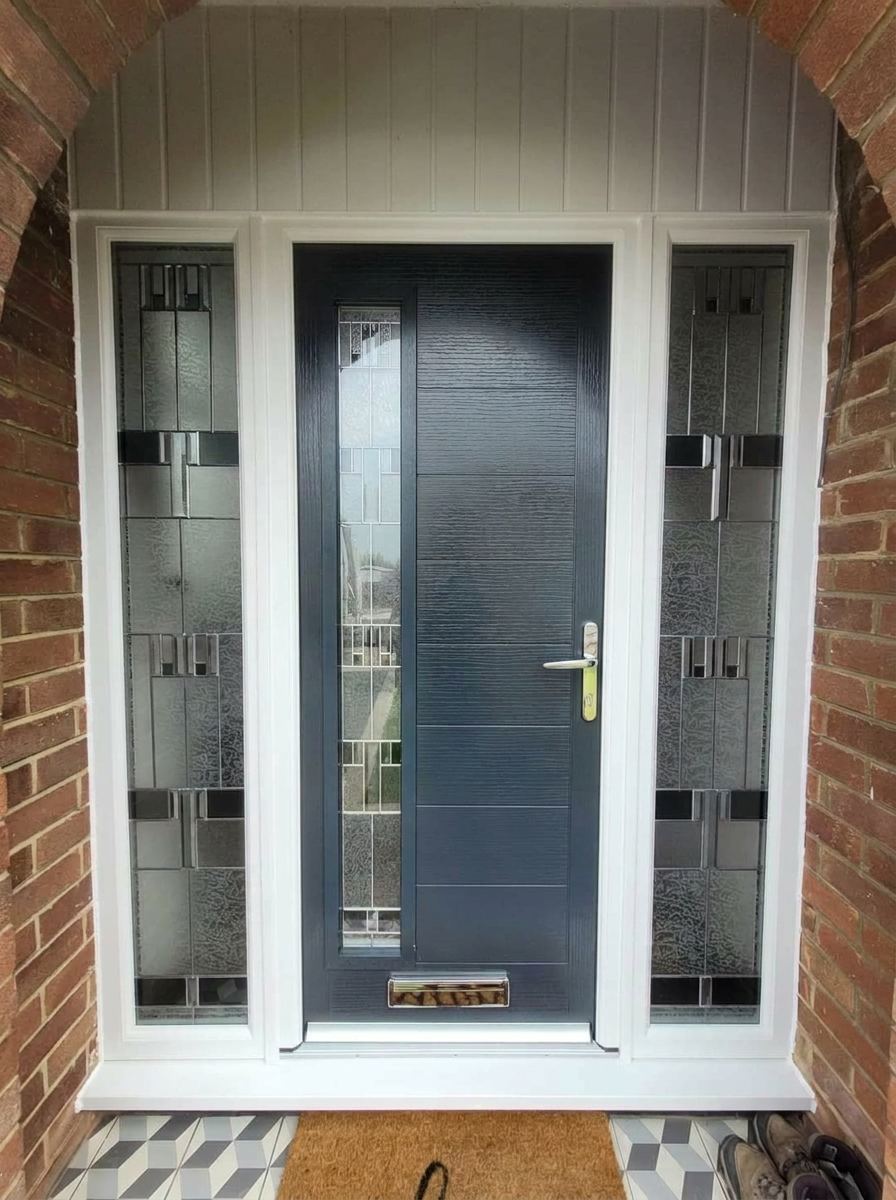 Anthracite grey composite door with tall decorative leaded glass sidelights